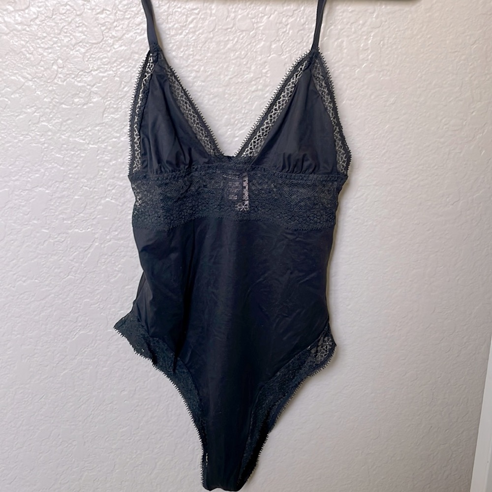 Victoria’s Secret black lace bodysuit. New with tags.